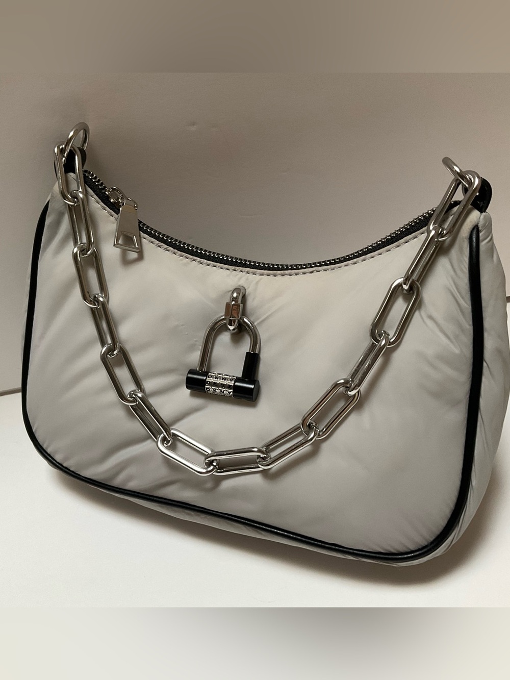 Gray puffy crescent Bag DKNY Harper Small Chain Crossbody bag padlock charm